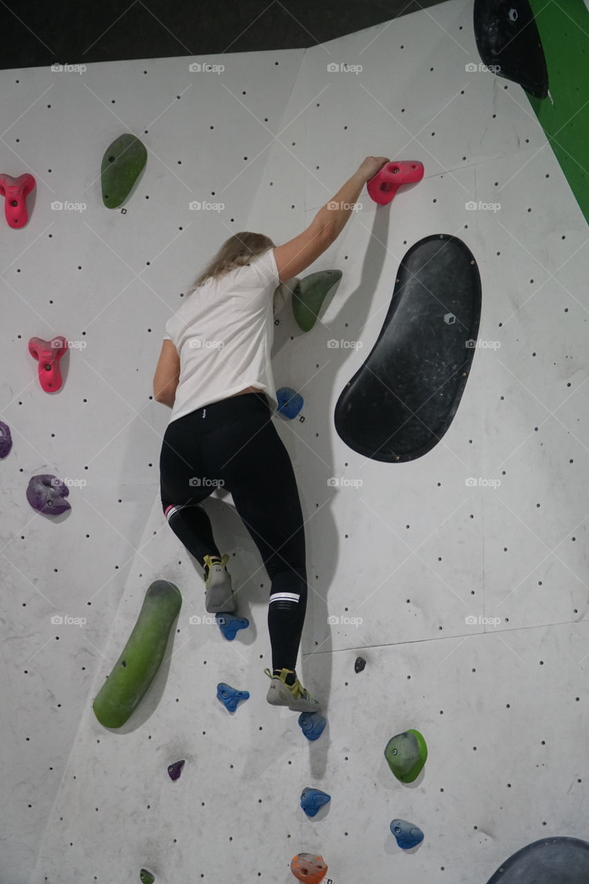 Girls rock climbing