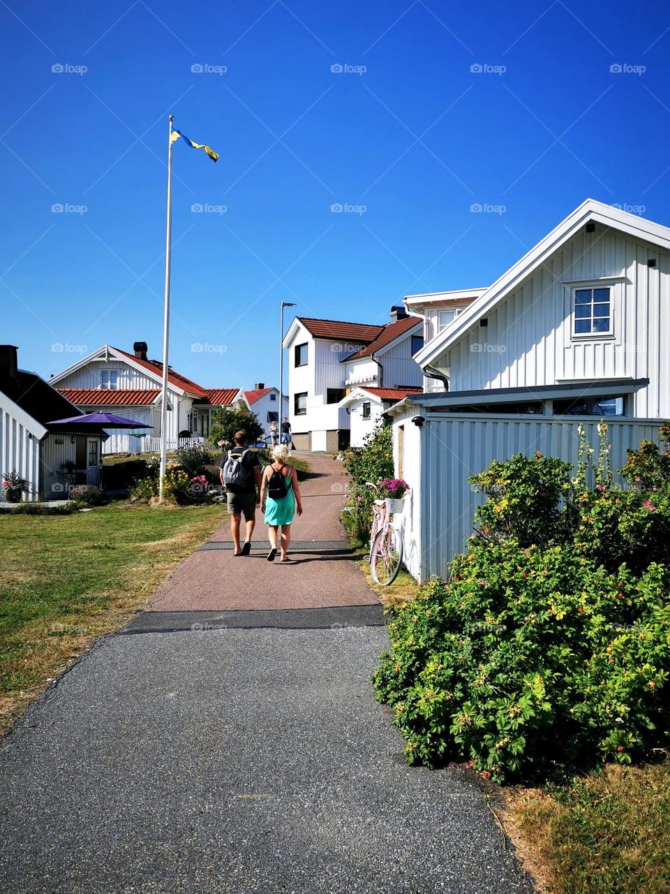 Summer in the Archipelago, white houses and tourists walking