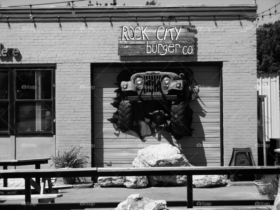 let me out. This is a picture of a jeep stuck in a garage door on display at a restaurant 🍴 in Jacksboro Texas