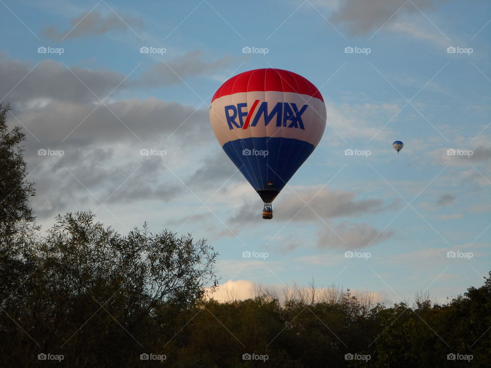 Remax hot air balloon over the woods