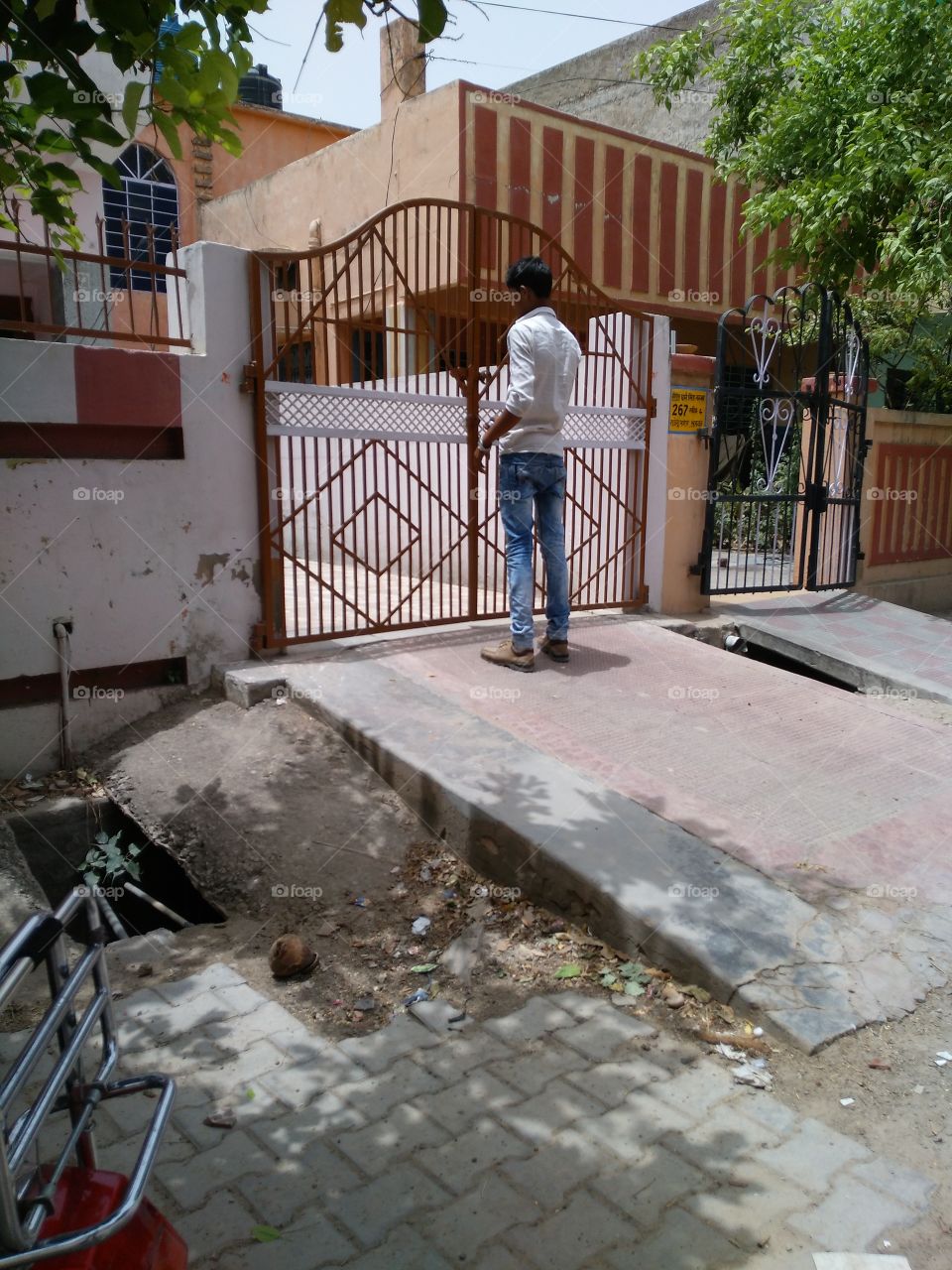 man opening main gate.