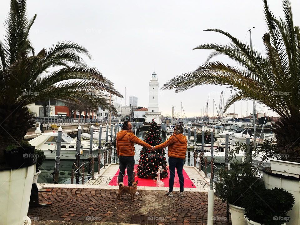 tourists take photos at the sea in winter,