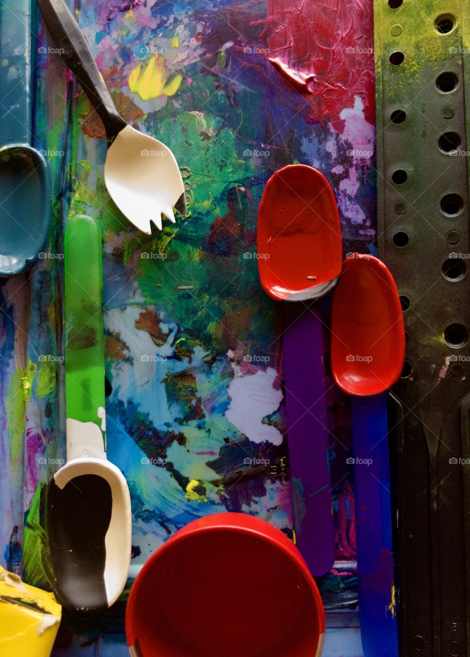 Used paint scoops on plastic palette