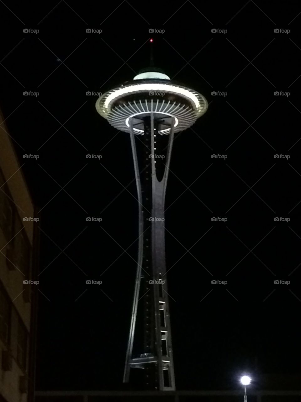 Seattle space needle . Space needle in Seattle lit up at night. 