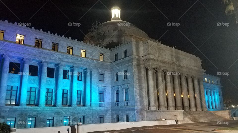the capital building of San Juan Puerto Rico lit up like a beacon in the night sky