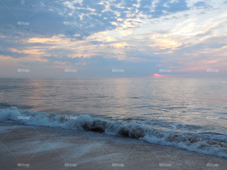 Dewey beach Maryland sunrise on cloudy day