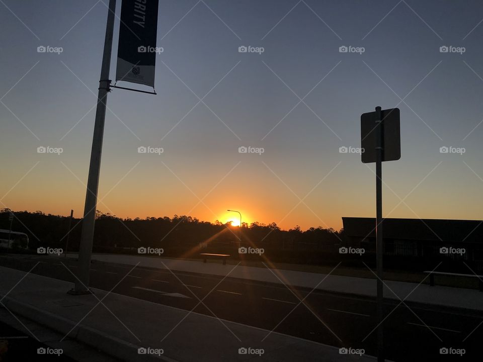 Sun setting in the sky