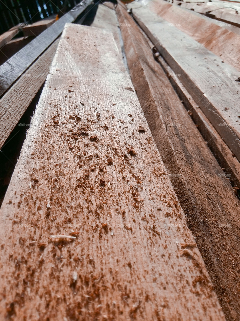wooden boards with sawdust in the street
