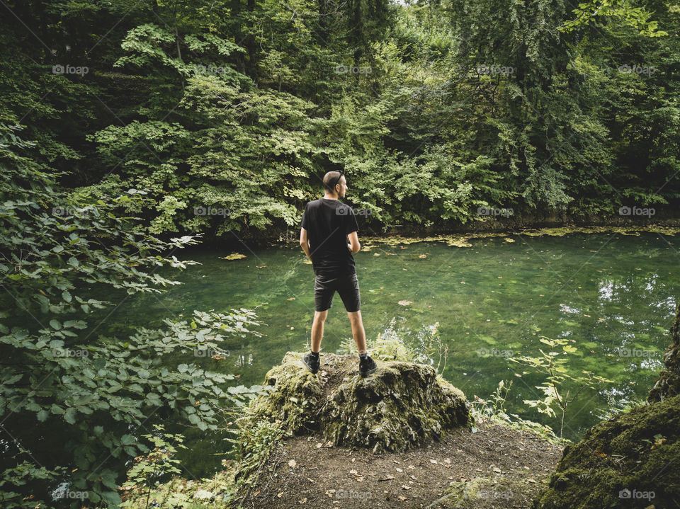 man standing against nature