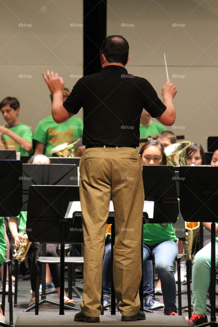 One, two, three, four. Band director and band