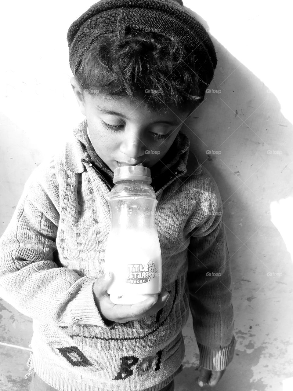 my beautifull baby Sameer Rana Drinking Feedr milk so amaizing nd awesome picture..