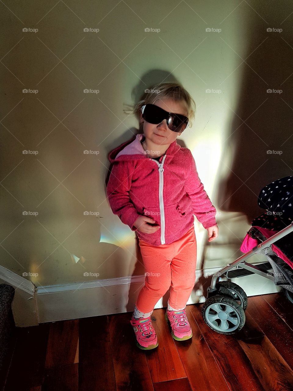 Cheeky little girl in sunglasses