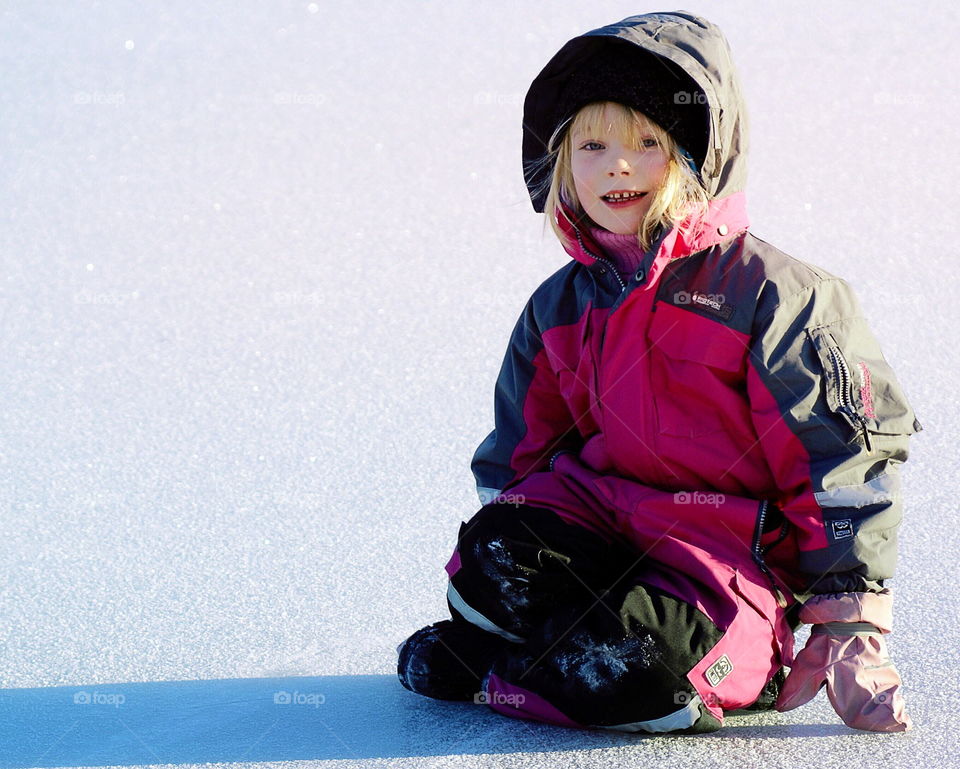 Girl sitting in the snow