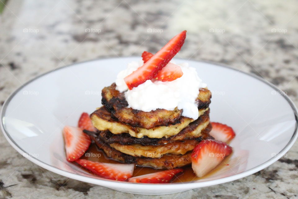 Close-up of pancakes with strawberry slice