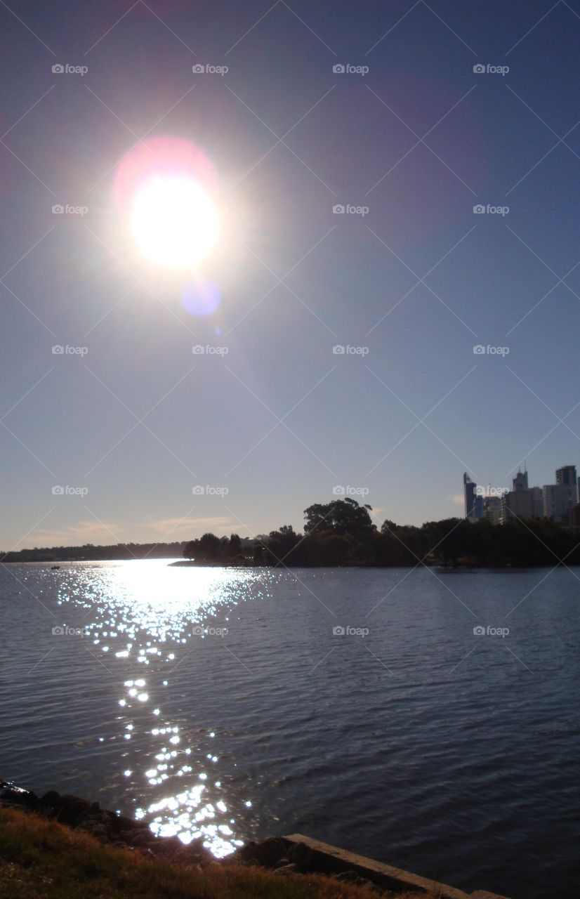 Riverside with the sun.