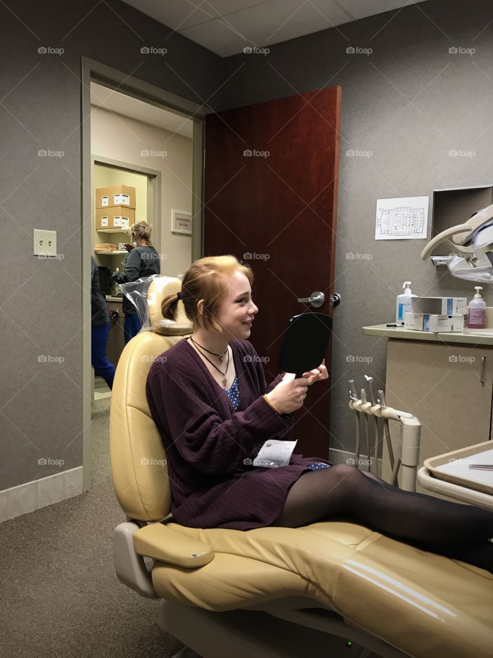 Woman sitting on dentist chair