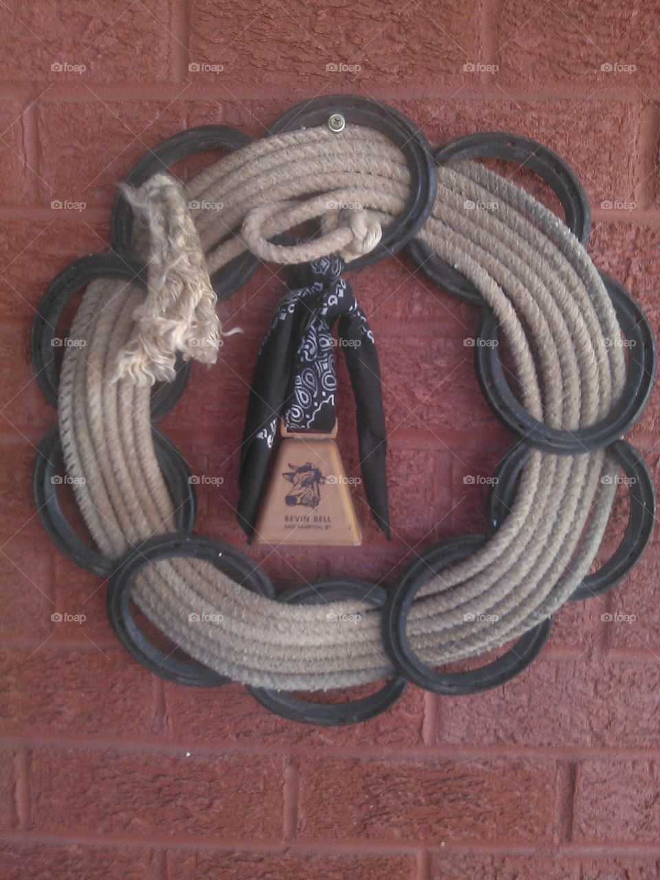 old cow bell. this is john wayne's rope and cow bell ( of course not)