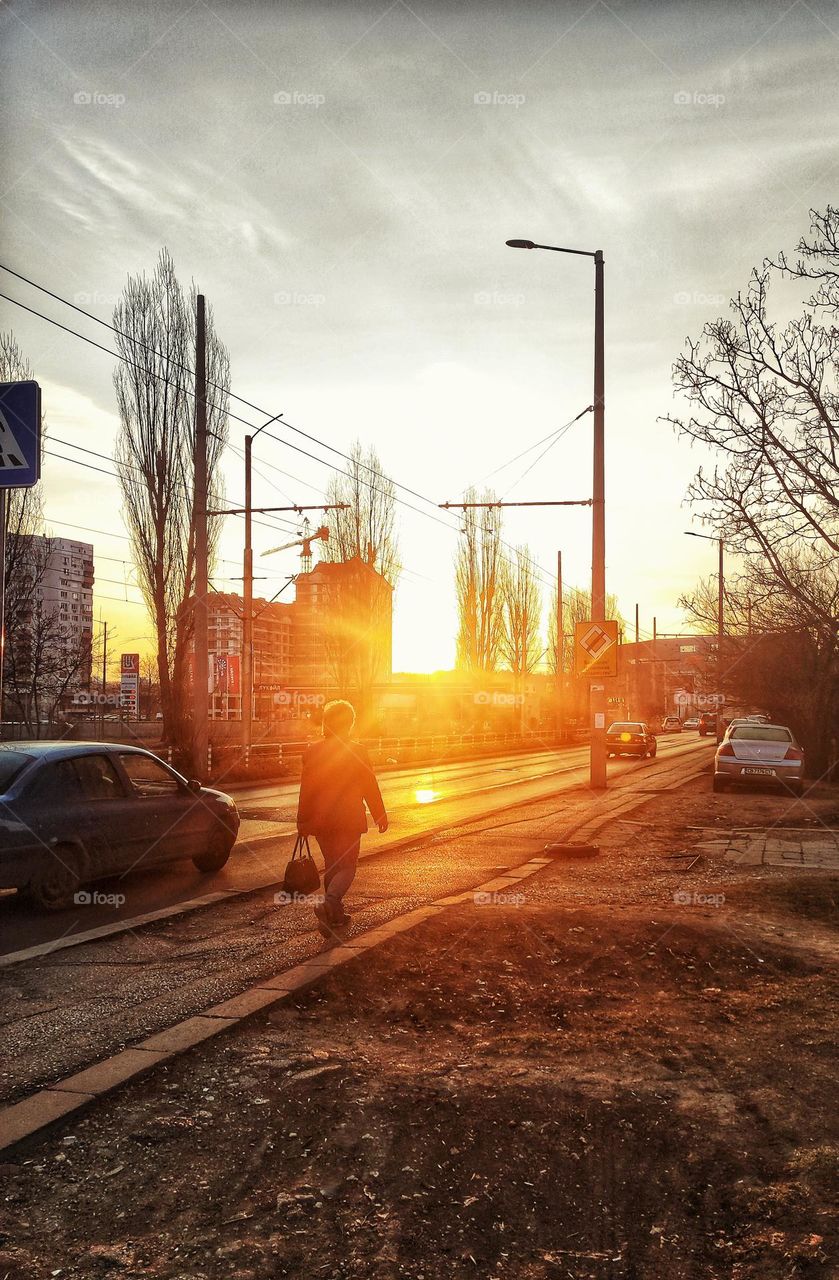 A beautiful photograph of an early morning sunrise in Bulgaria with busy people going to work