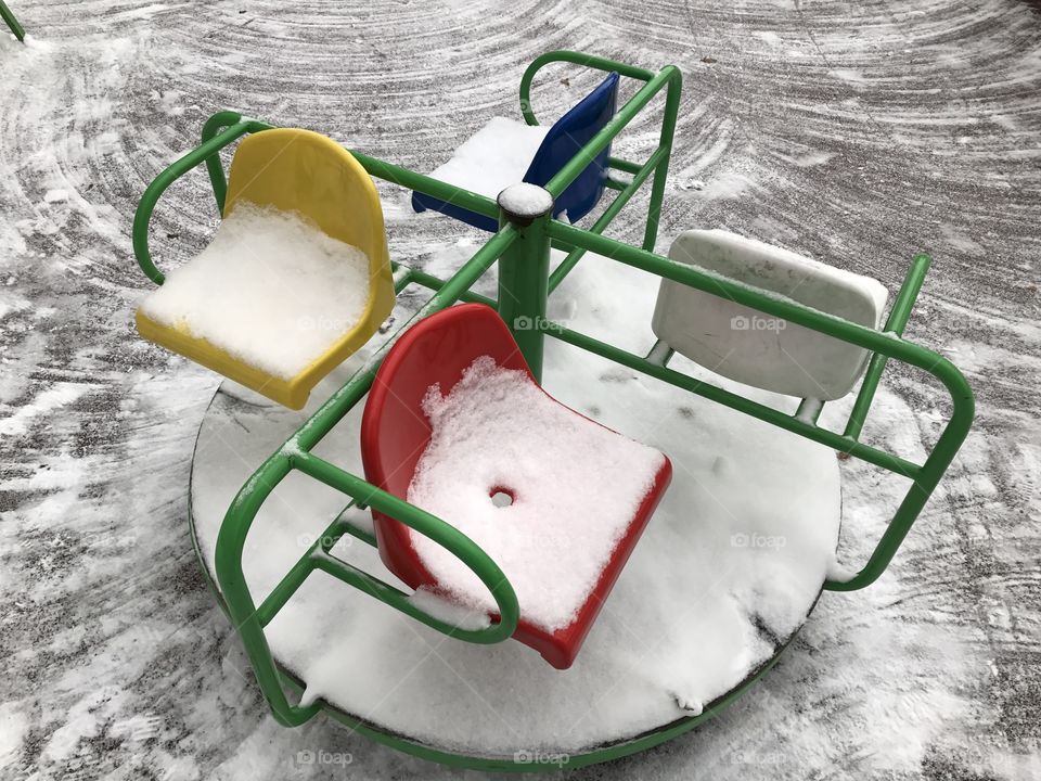 Colorful carousel in winter park