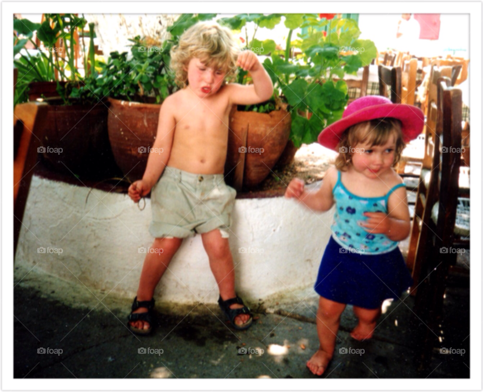 Children playing. Children dancing and playing in a Greek island
