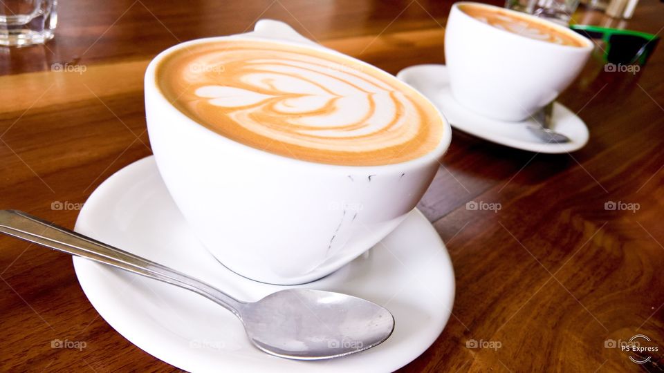 Coffee latte heart shaped foam design coffee shop