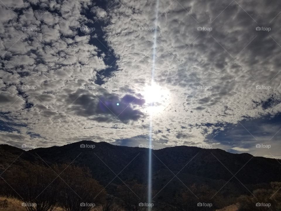 Sunbeam in a Cloudy Sky