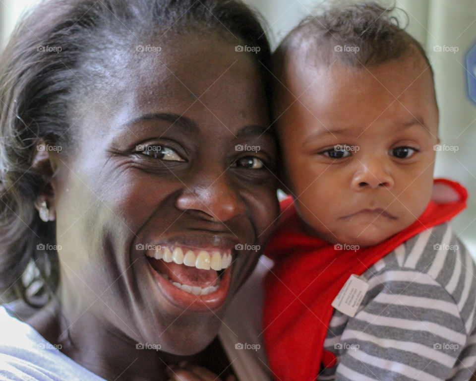 Smiling woman with infant