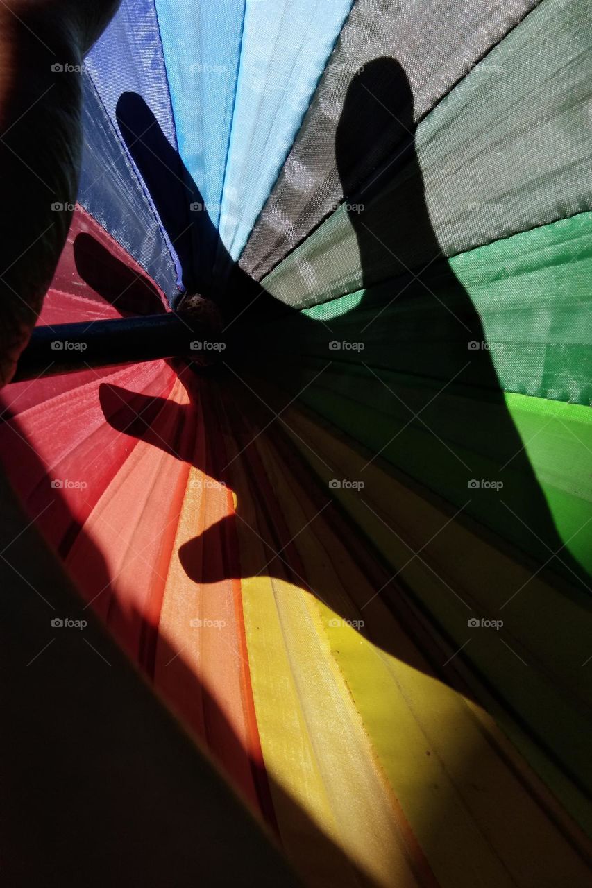 hand shadow on colorful background.