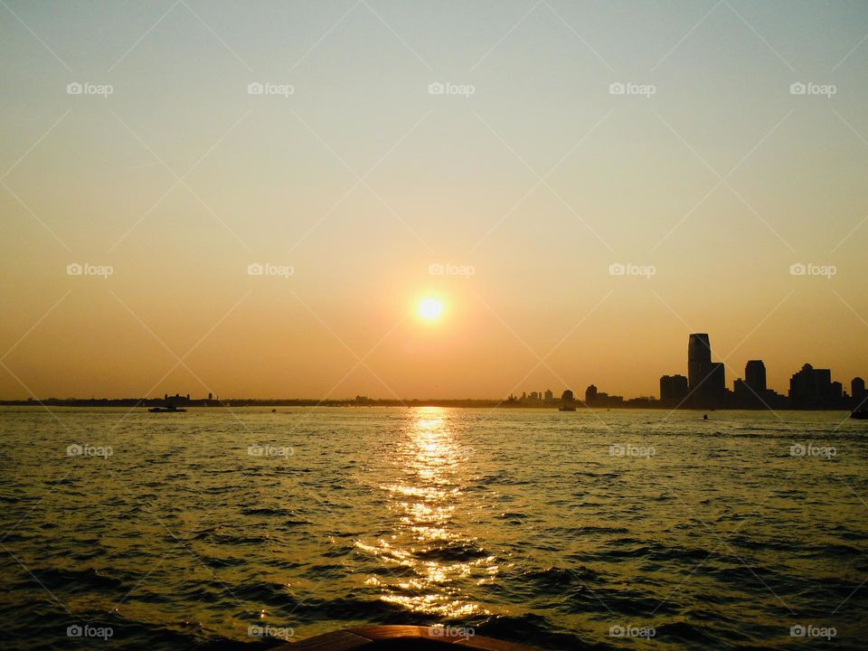 Sunset on the Hudson, with pretty pink hues and some city views. 