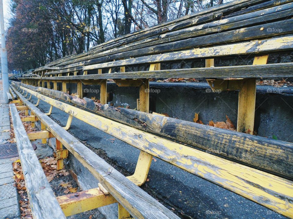 old wooden benches at the stadium, autumn