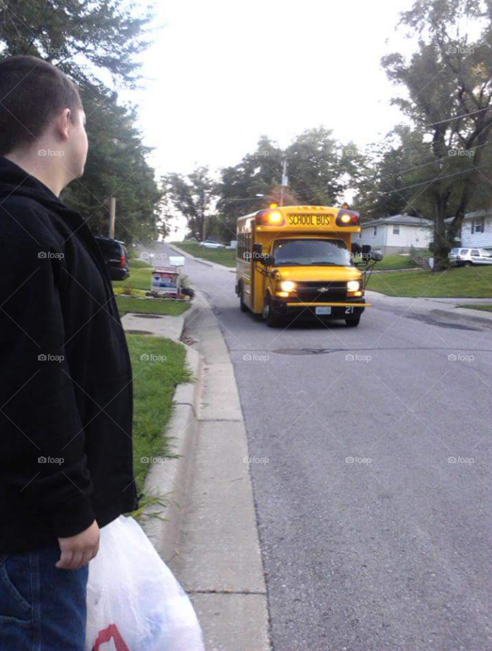 Boy and school bus