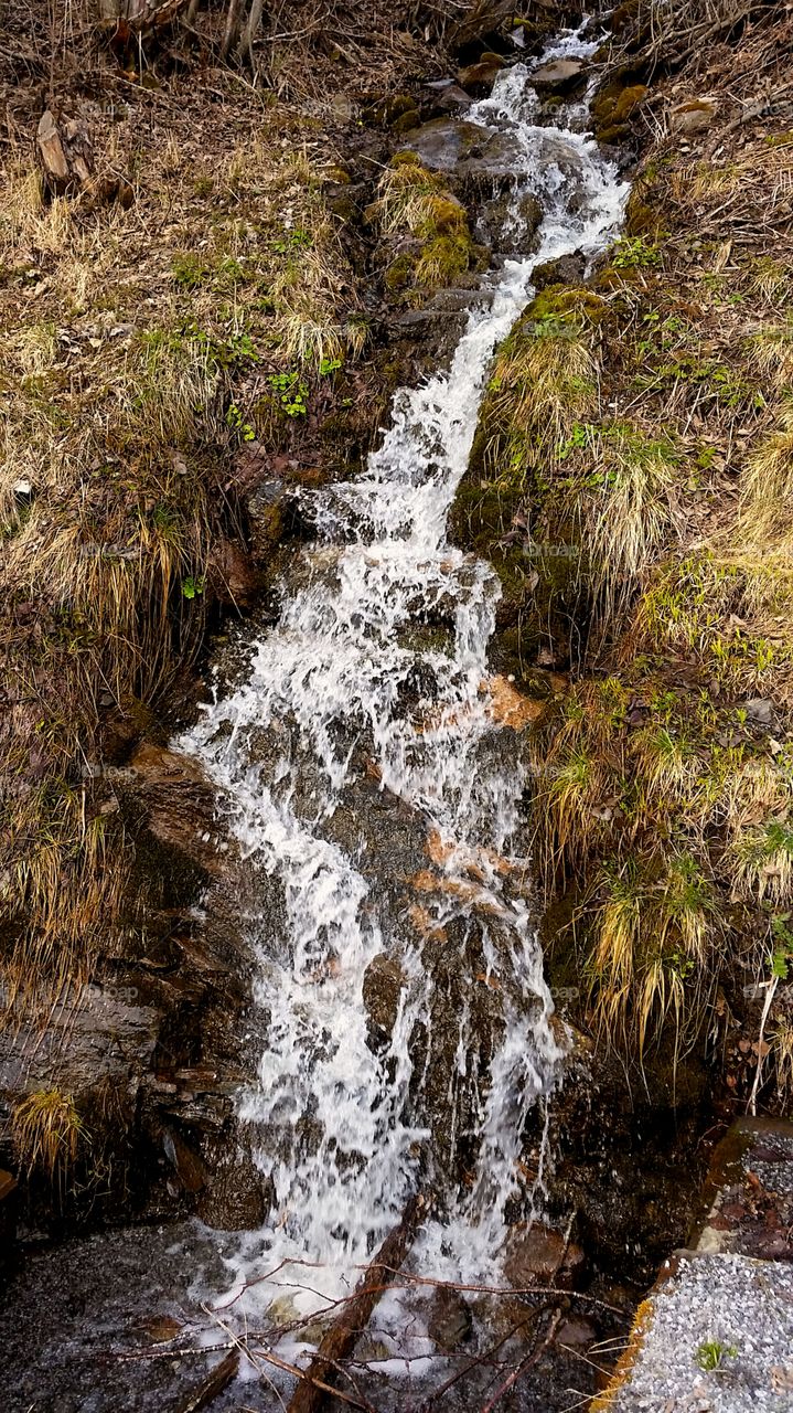 Small Waterfall after snowmelt on the mountain.