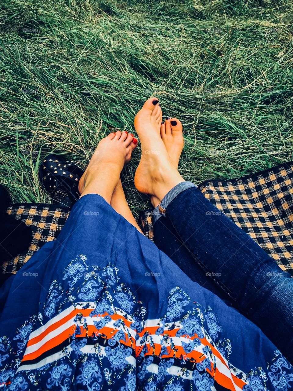 Summer. Picnic. Women’s legs and feet