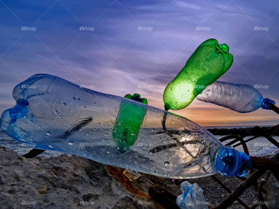 sad Quartet plastic bottle and sunset