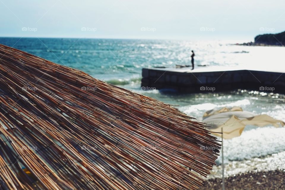 Close-up of thatched roof at sea