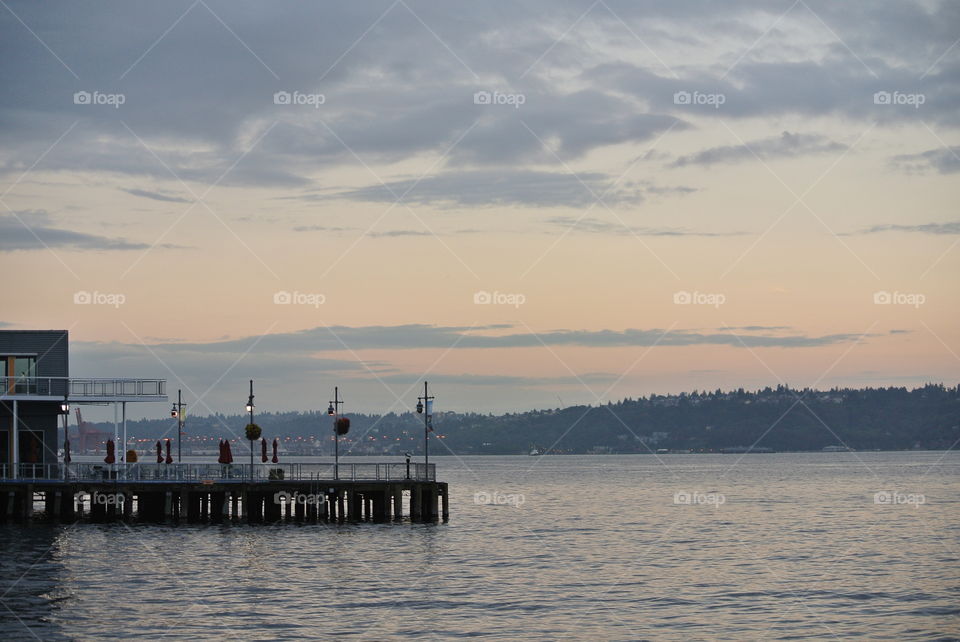 The beginning of a sunset on the Seattle waterfront mid summer