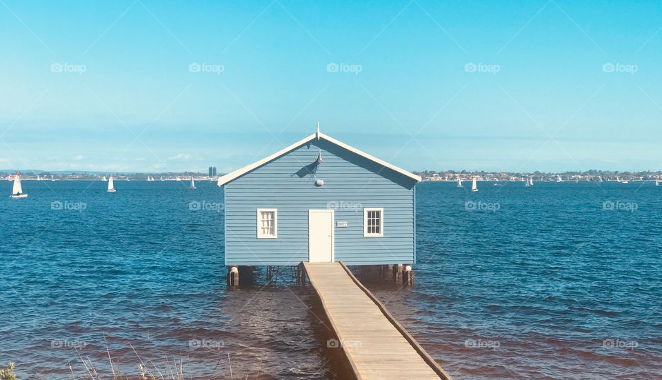 Blue house on water