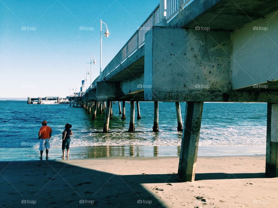 Couple by pier