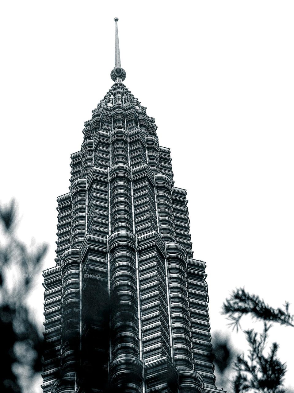 View of the Petronas Twin Towers from below, edited with dramatic black and white tone