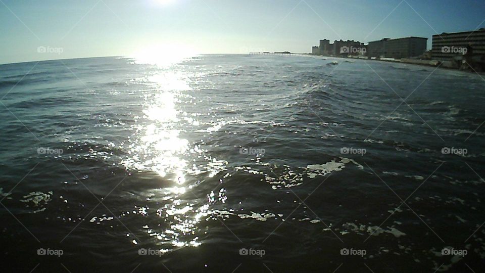 drone view of the beach,  ocean, sun, sky