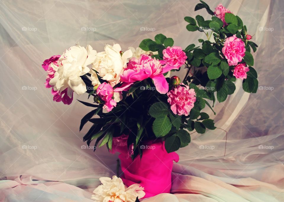 bouquet of peonies and roses in a vase