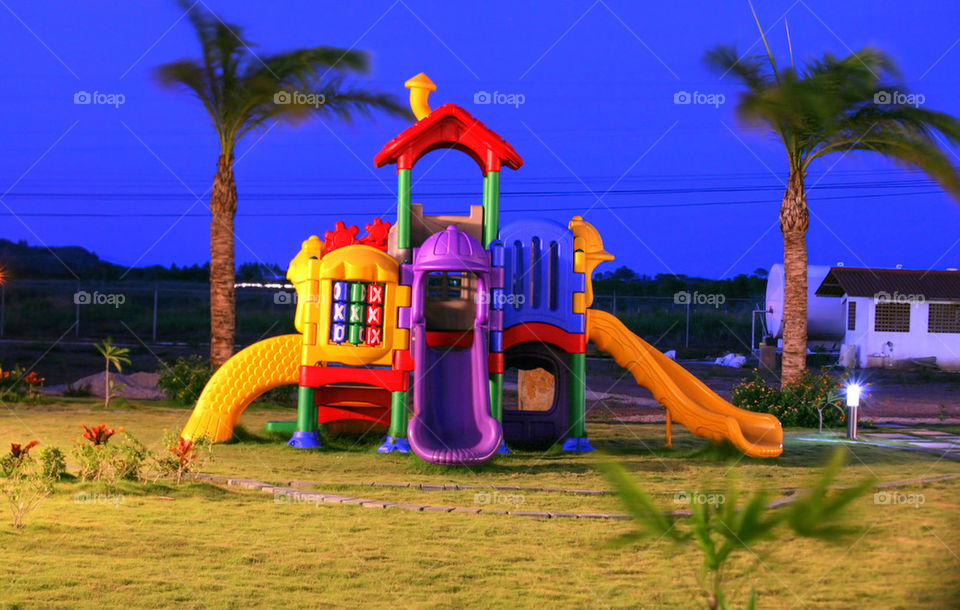 colorful playground for childrens in the sunset.  focus on the x and 0