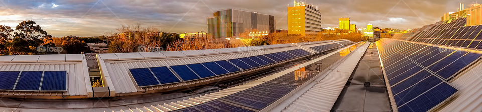 Panorama of solar panels on rooftop