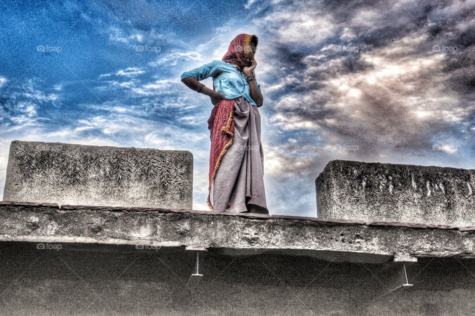 Indian lady on roof top, Rajasthan, India . Indian lady on roof top, Rajasthan, India 