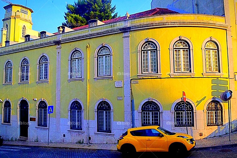 Yellow building and yellow car