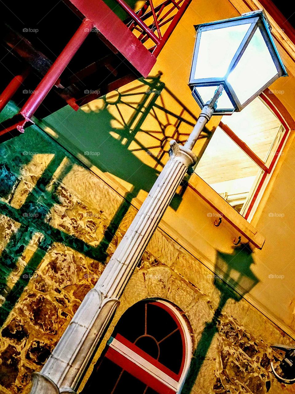 low angle / tilted angle shot of Street Light shadow on Wall !