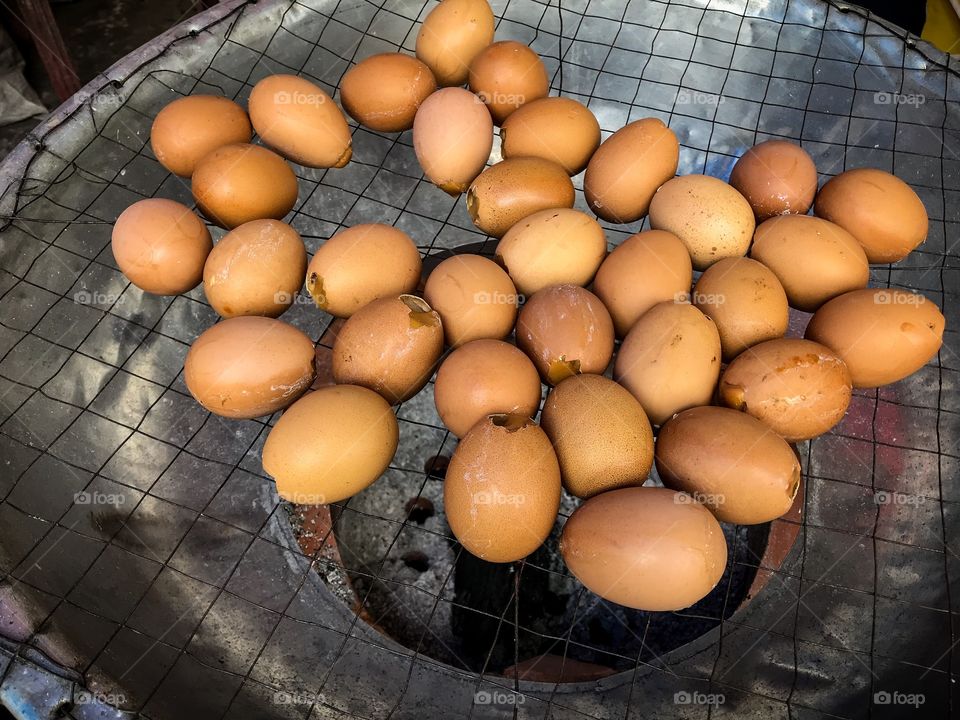 Eggs cooking at market, Thailand 