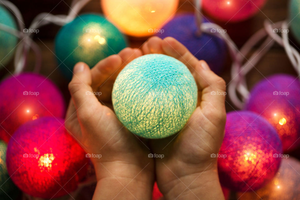Close-up of a person holding Christmas bauble