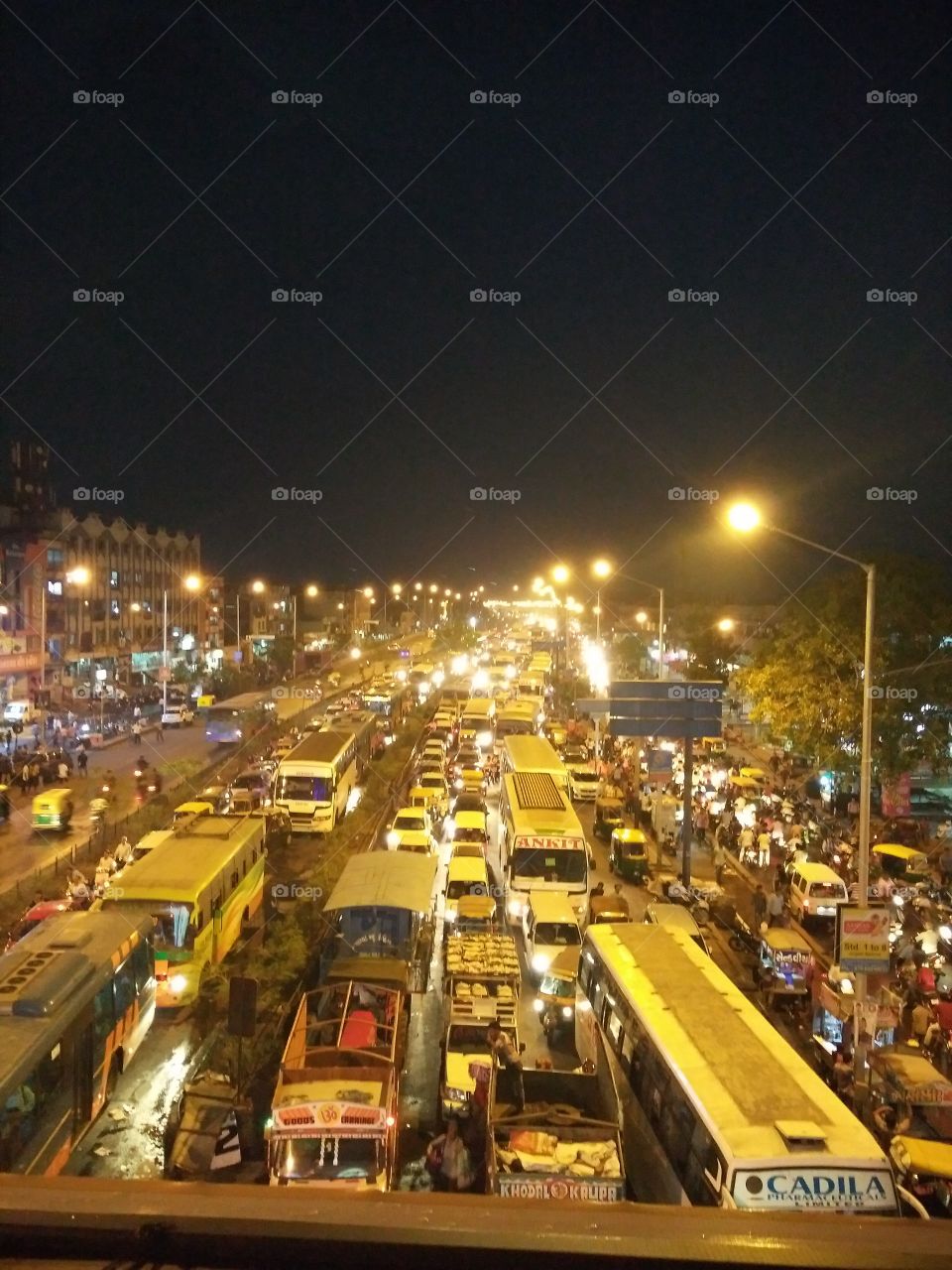 The traffic of Ahmedabad Gujarat. All people are going towards their home but due to some rain at a time there was a big issue of traffic is created.