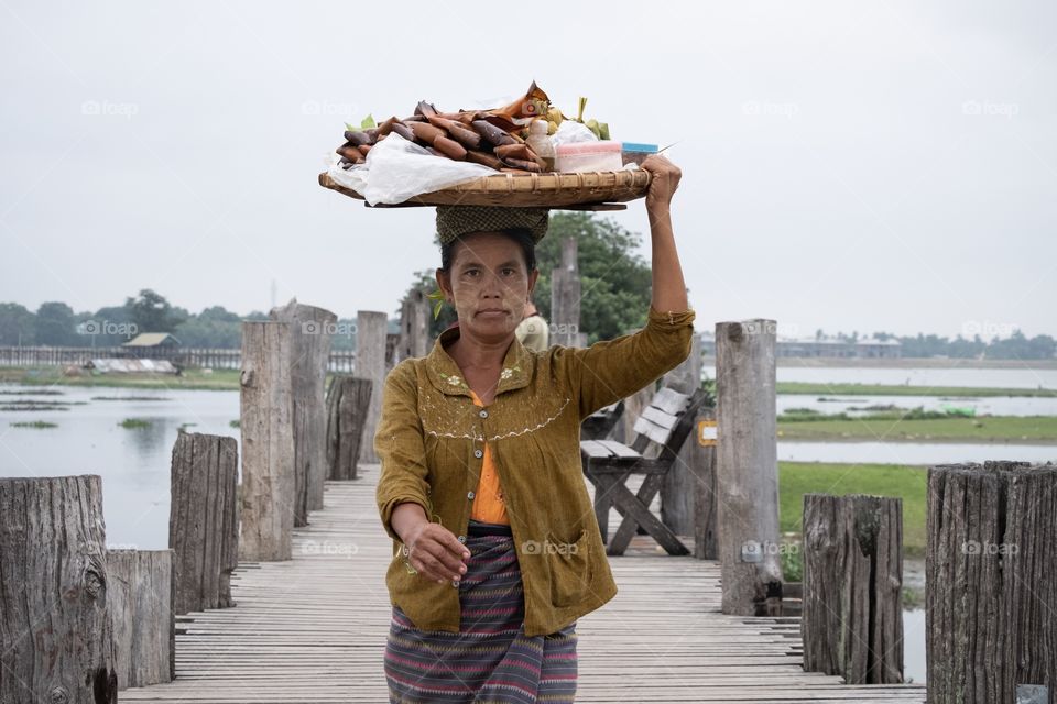 Balancing is important for living...
People carry goods on her head are walking to morning market on U being bridge , the most longest wooden bridge in the world